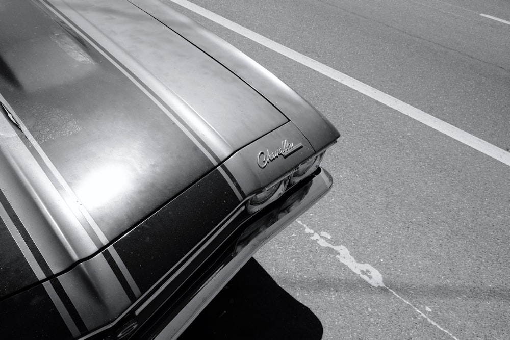 black car on gray asphalt road