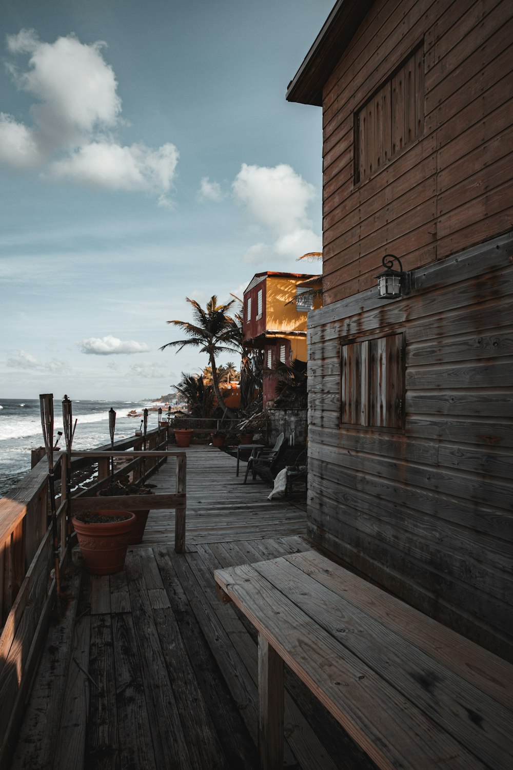 brown wooden dock near body of water during daytime