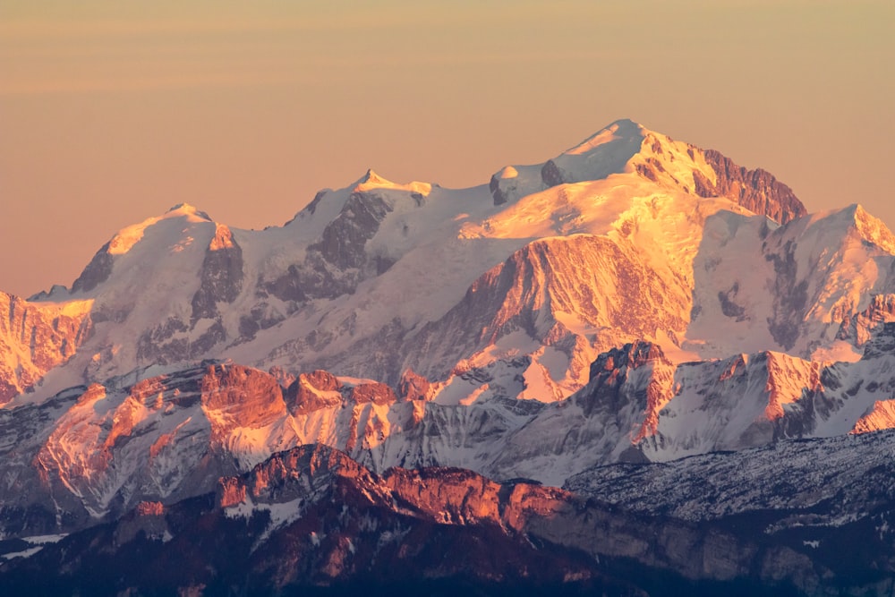 brown and white mountains under white sky during daytime