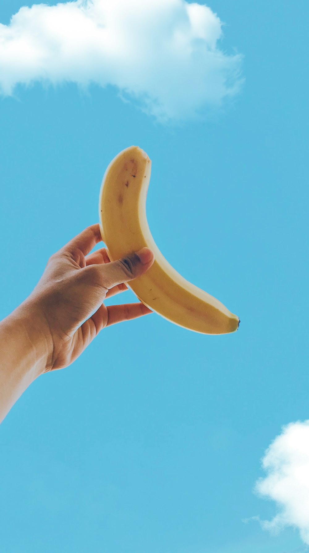 person holding yellow banana fruit