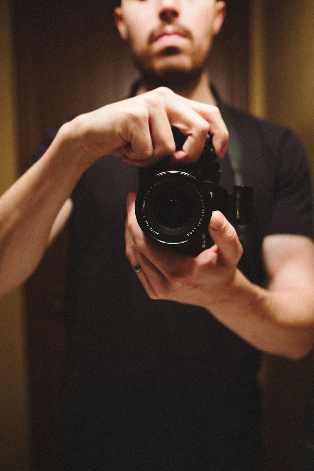 person holding black dslr camera