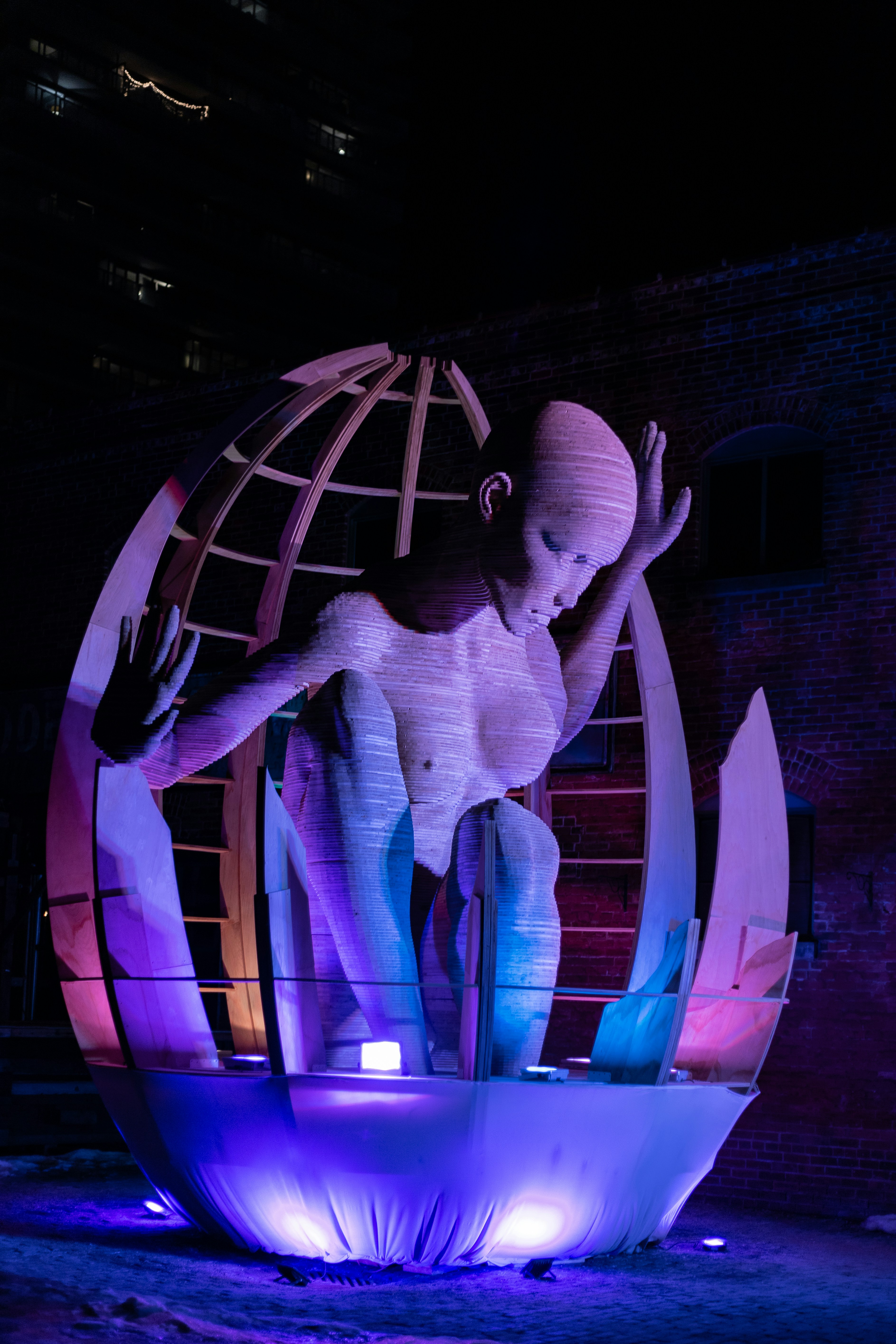 man and woman kissing on purple light