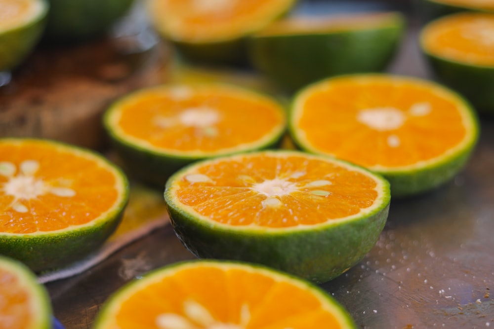 sliced orange fruit on brown wooden table