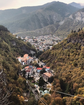 Lush green mountains surrounding the charming streets of Gramado in autumn