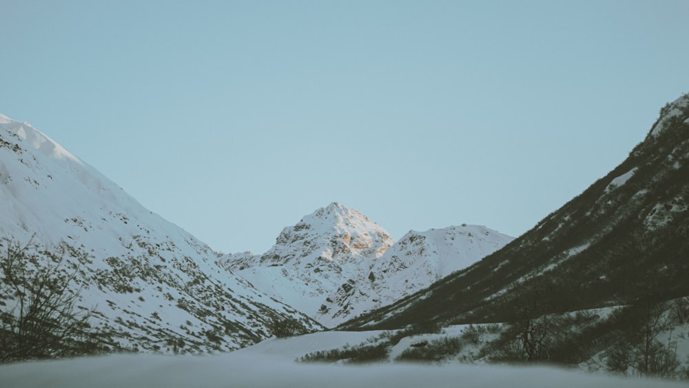 snow covered mountain during daytime