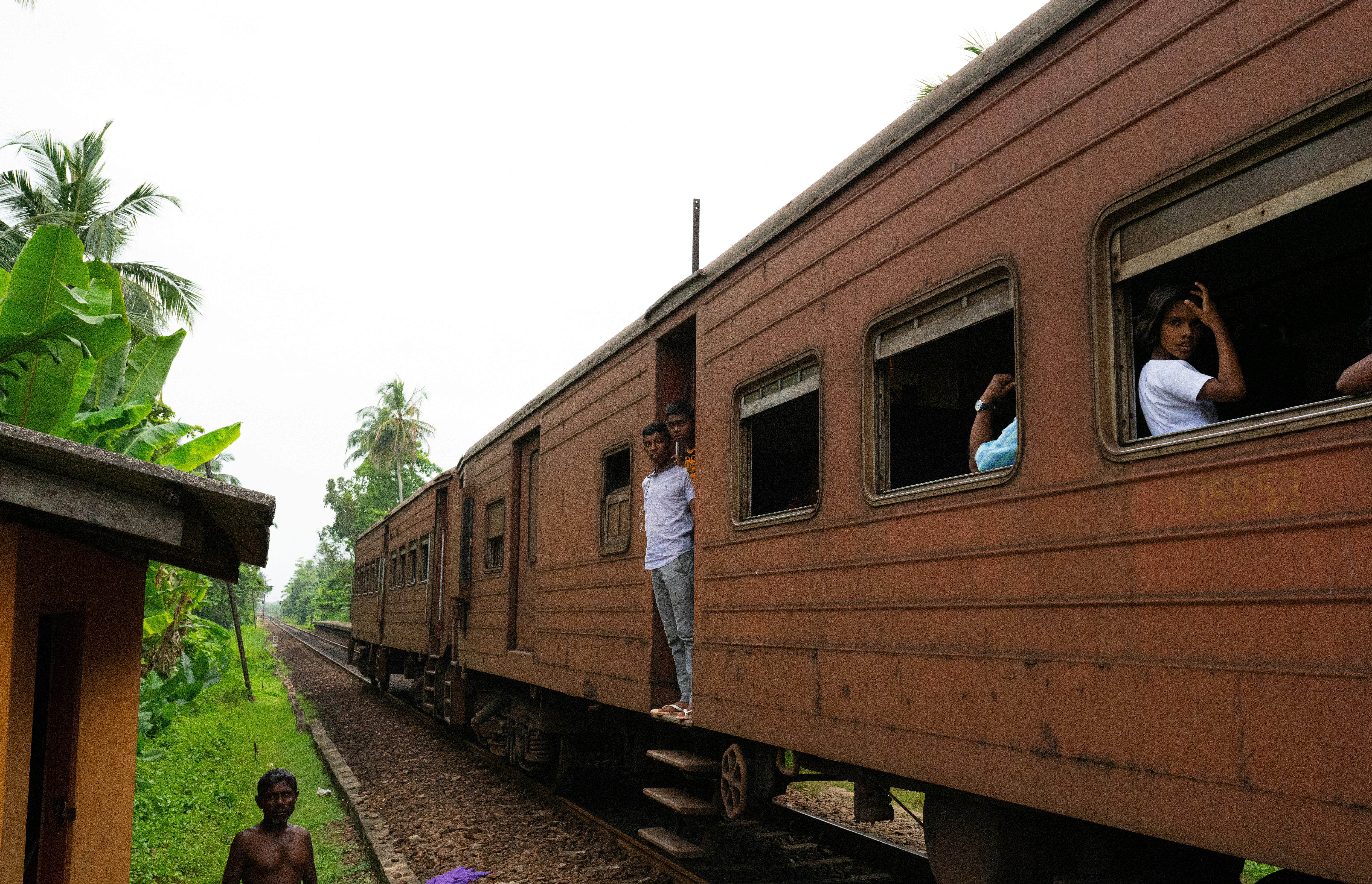 brown and black train on rail tracks during daytime
