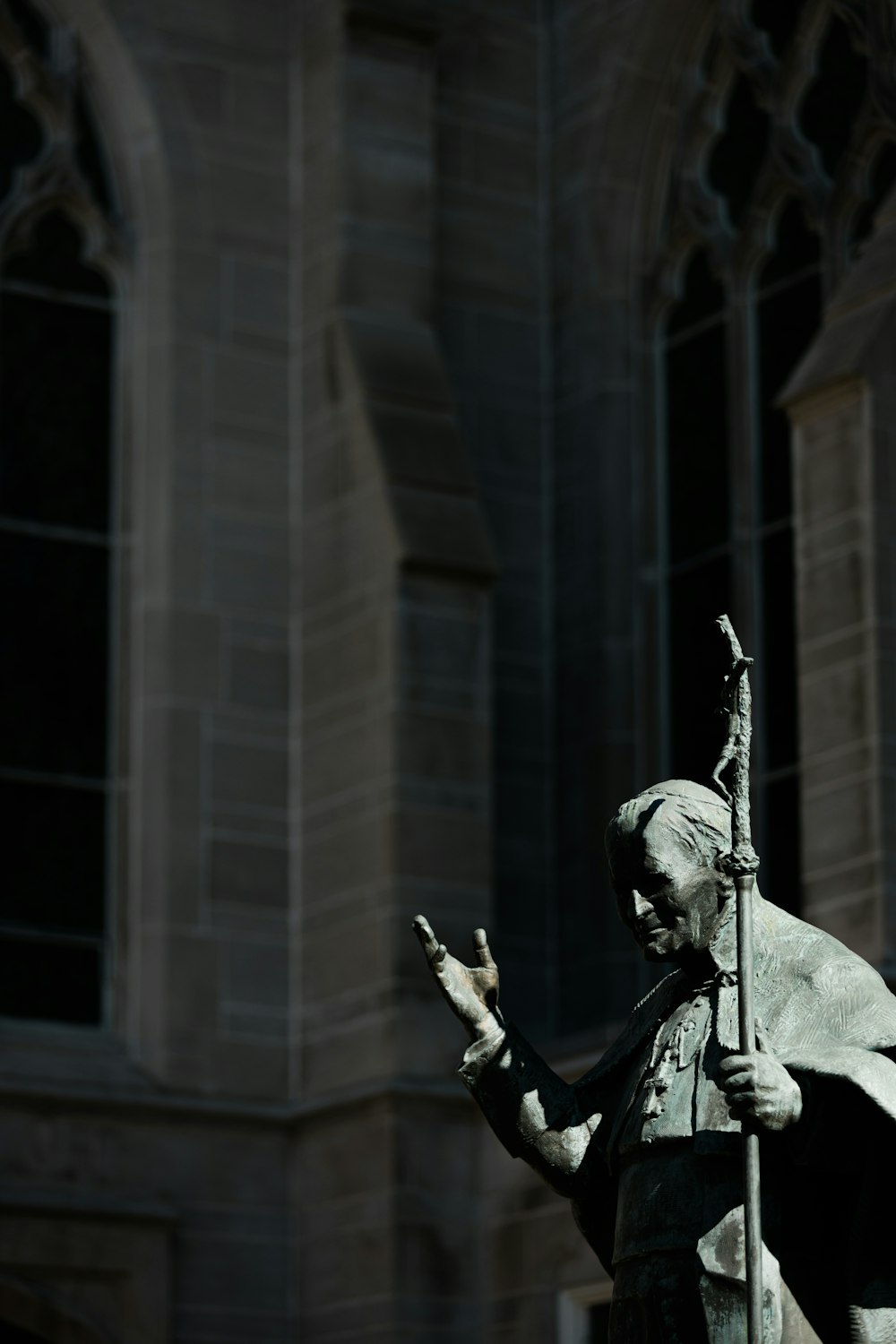 man in black leather jacket statue