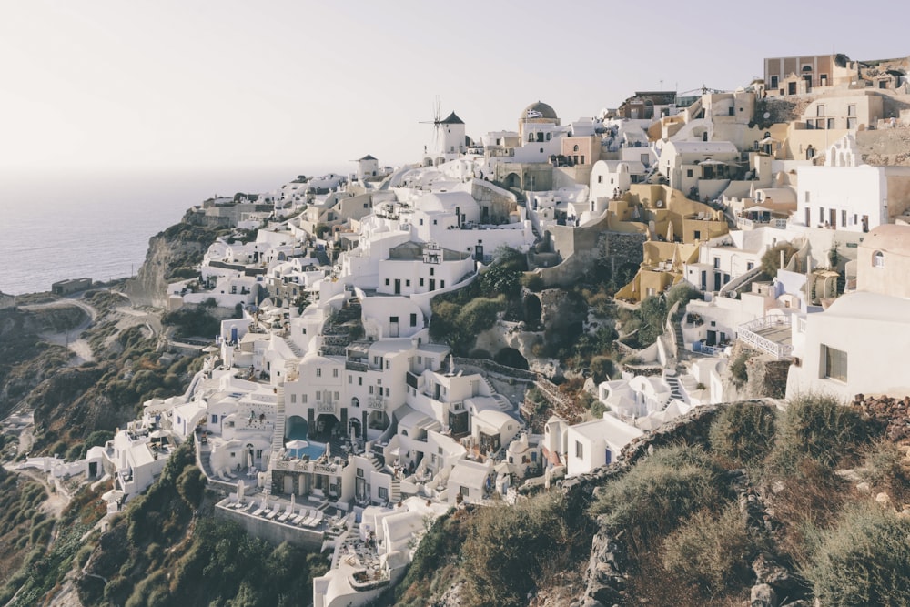 white concrete houses on mountain during daytime