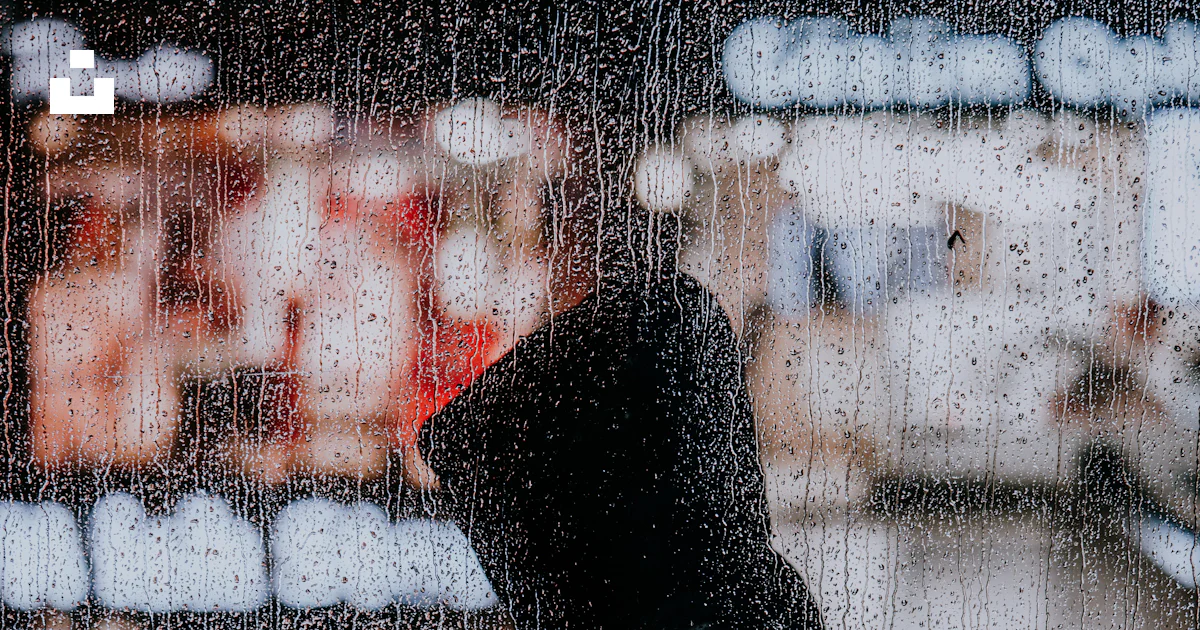 Silhouette of person in front of glass window photo – Free Street photography Image on Unsplash