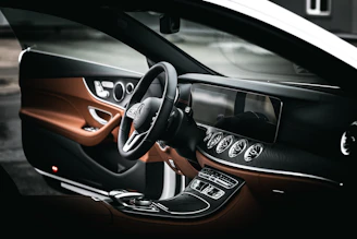 black and orange car steering wheel