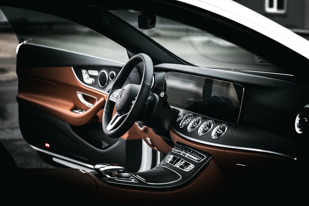 black and orange car steering wheel