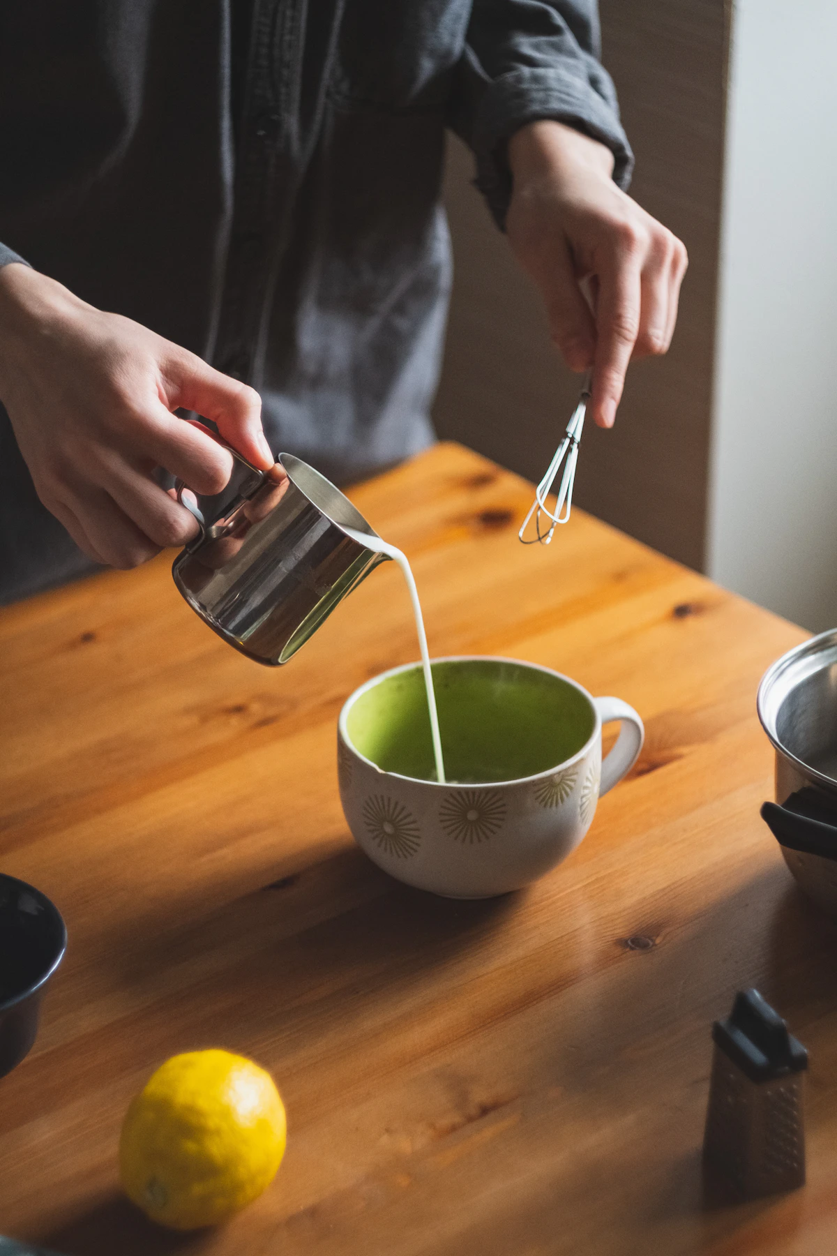 Matcha latte lifestyle moment in a bright cafe setting