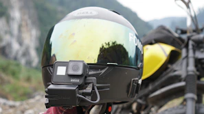 Close-up of an action camera mounted on a helmet during an adventurous city bike ride.