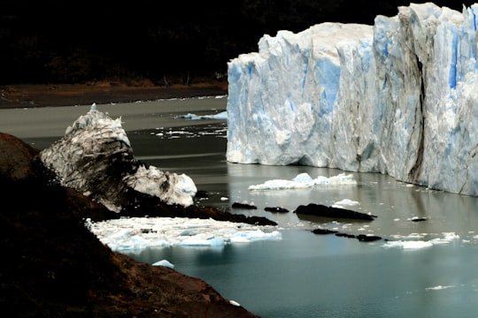 white and brown rock formation on body of water during daytime in Glaciar Perito Moreno Argentina