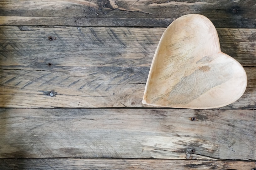 A close-up of a natural wooden bowl showcasing its smooth grain and warm tones.