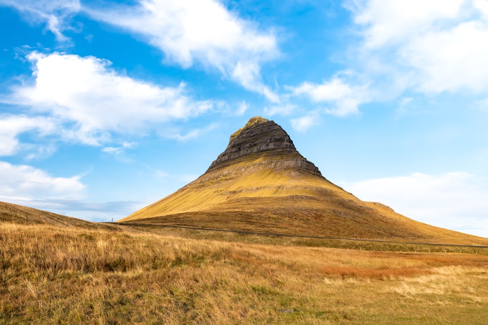 brown mountain under blue sky during daytime