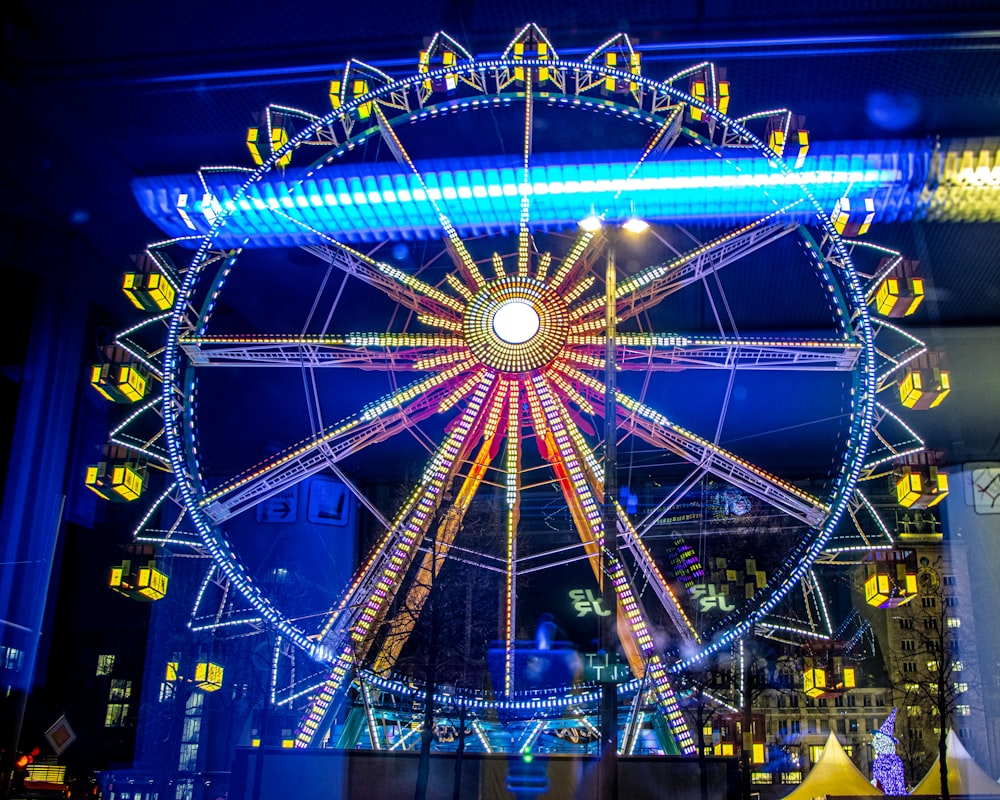 ferris wheel with lights turned on during night time
