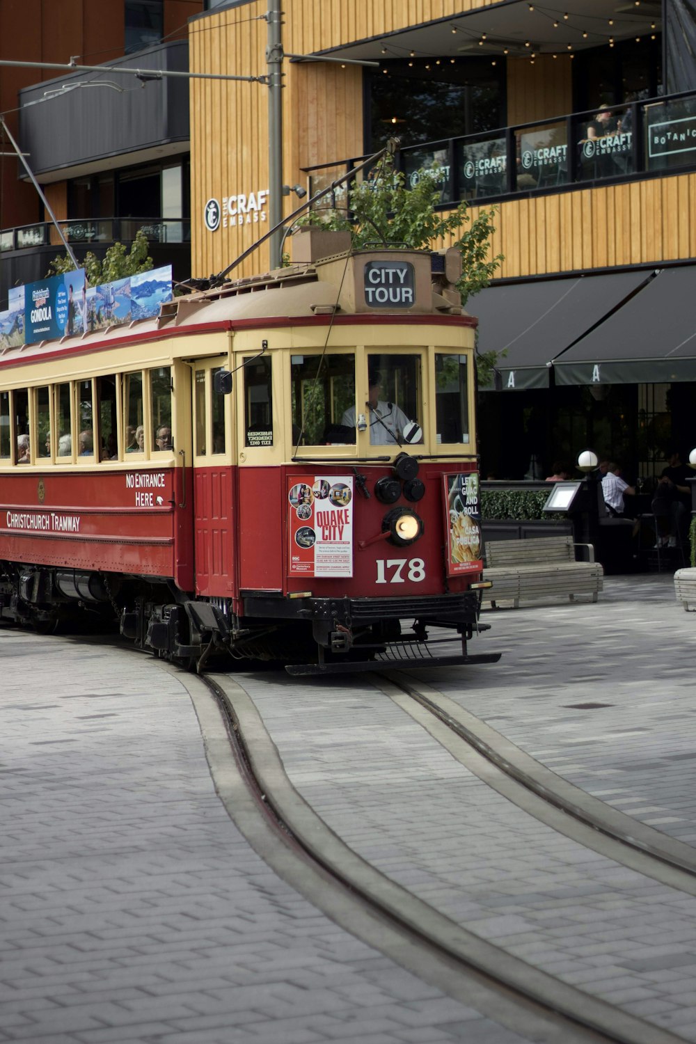 red and white tram on road during daytime