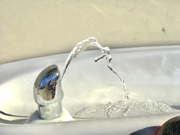 A close-up of a smart pet water fountain with flowing water and LED indicators