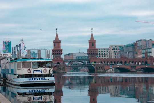 brown and white concrete building near body of water during daytime in Oberbaum Bridge Germany