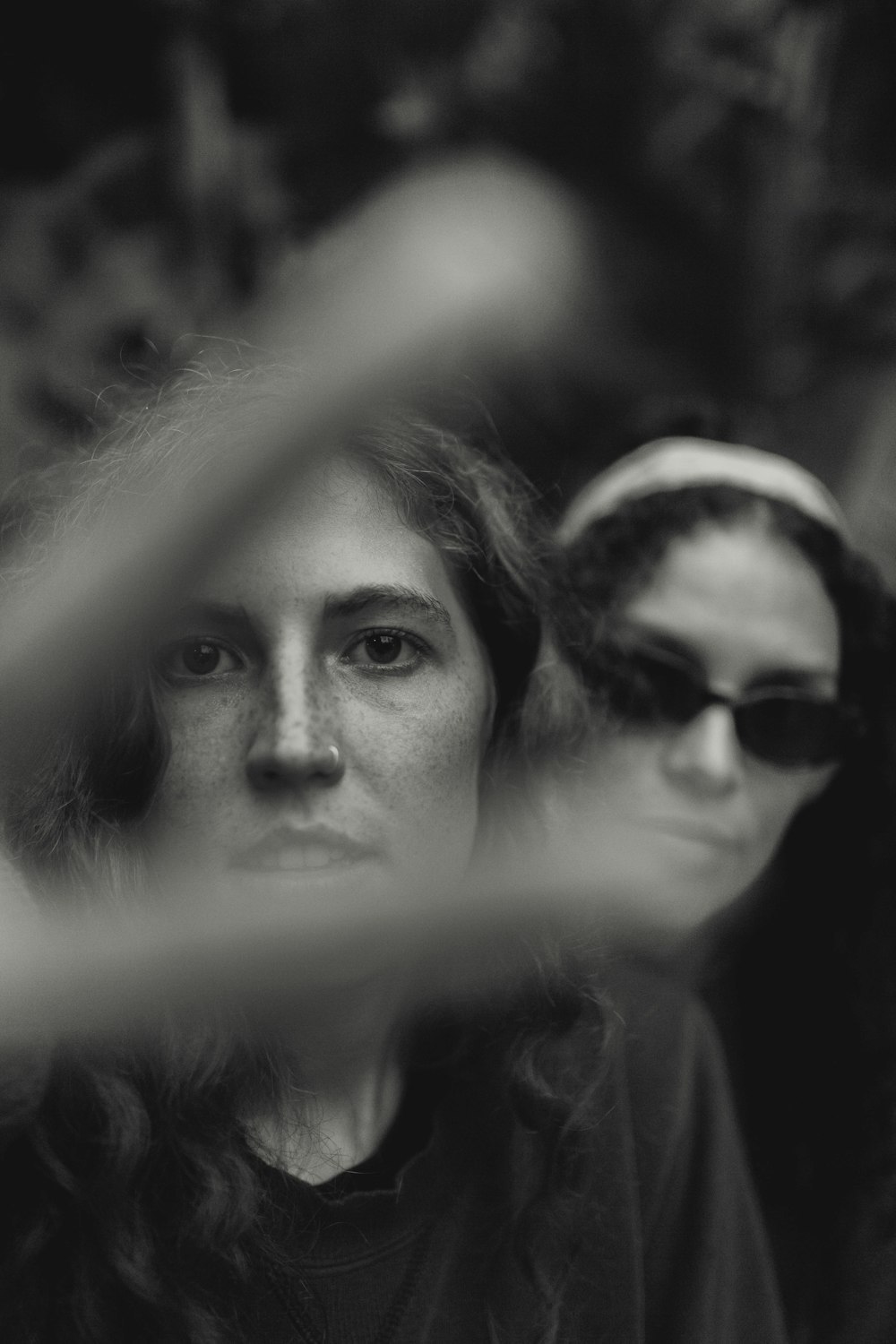 grayscale photo of woman wearing sunglasses