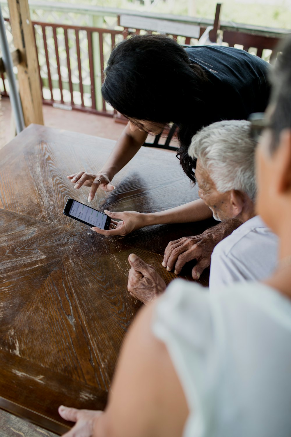 man in white shirt sitting beside man in white shirt