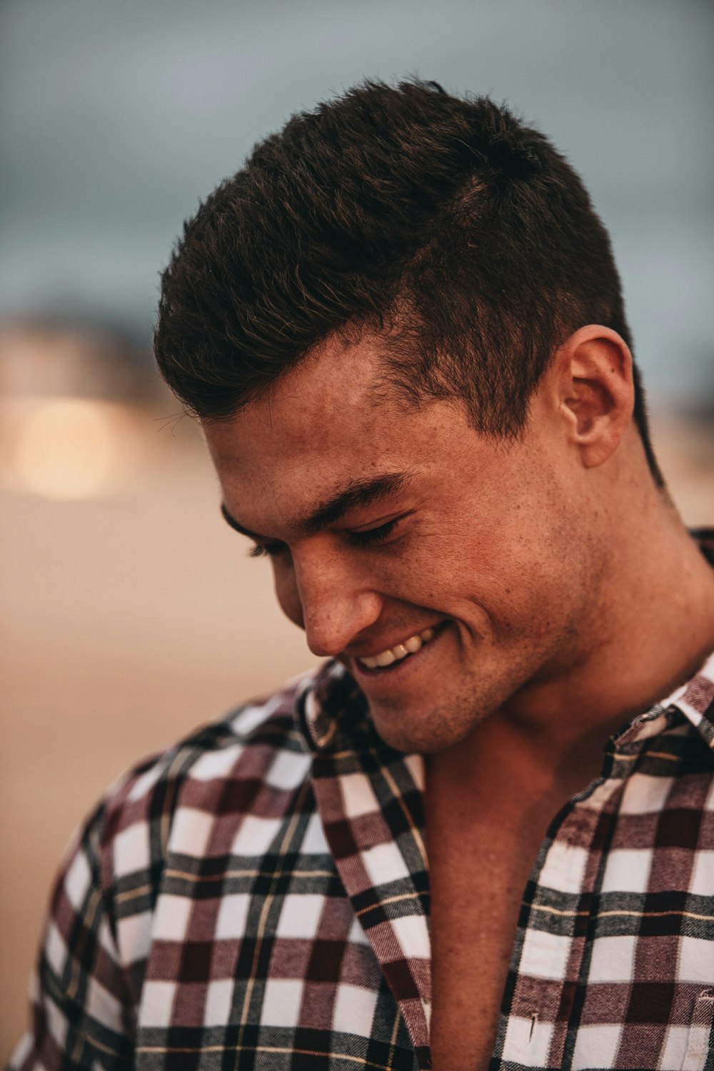 man in black and white plaid button up shirt