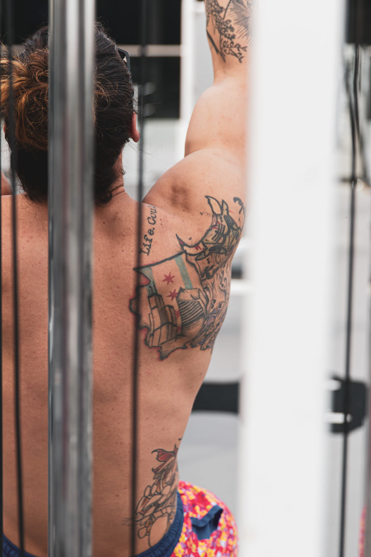 Black and red dragon tattoo across a back