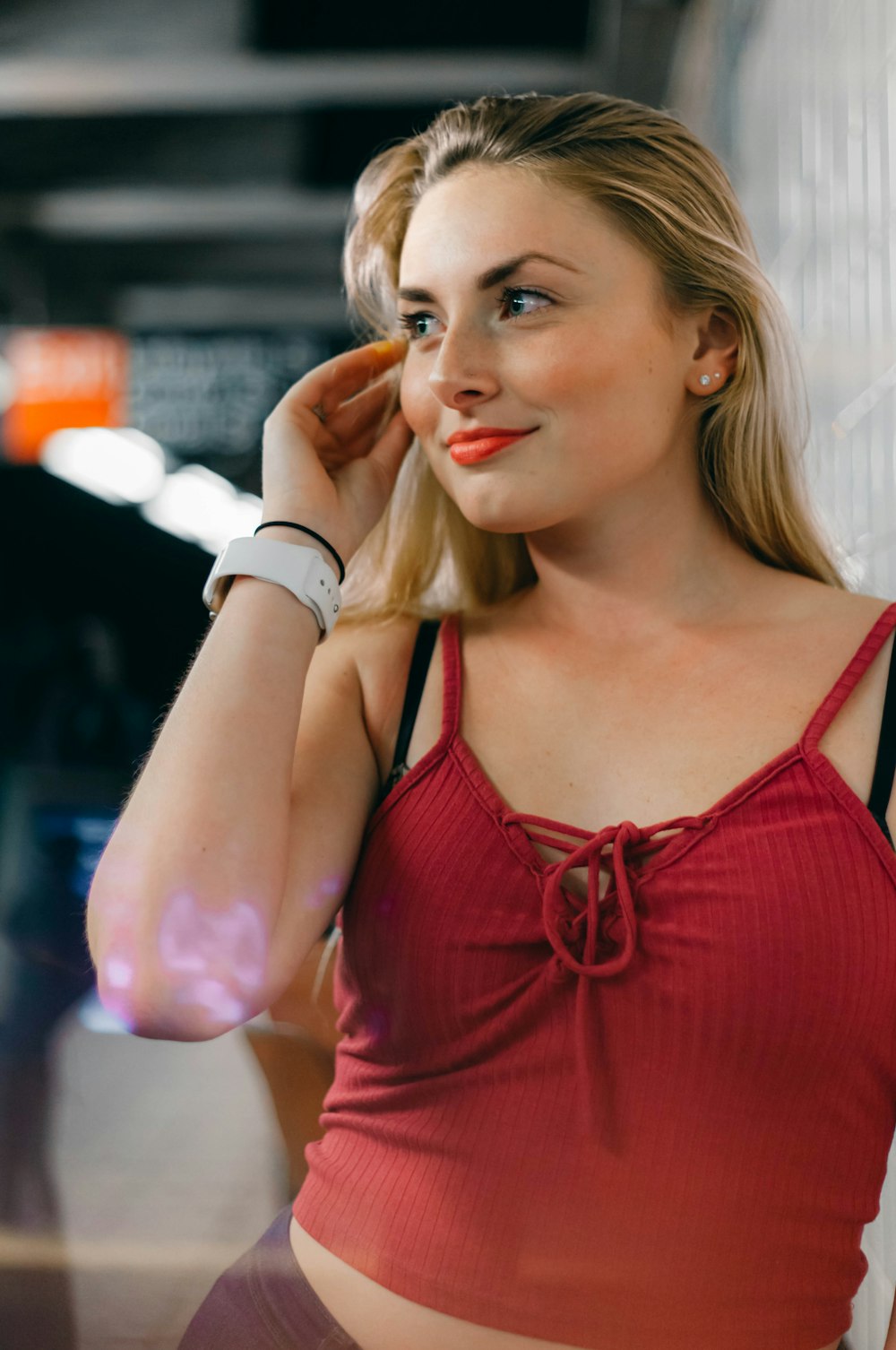 woman in red spaghetti strap top