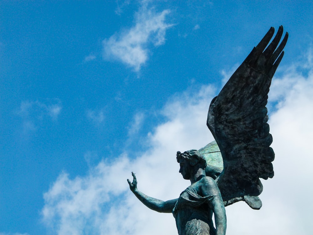 black concrete statue under blue sky during daytime