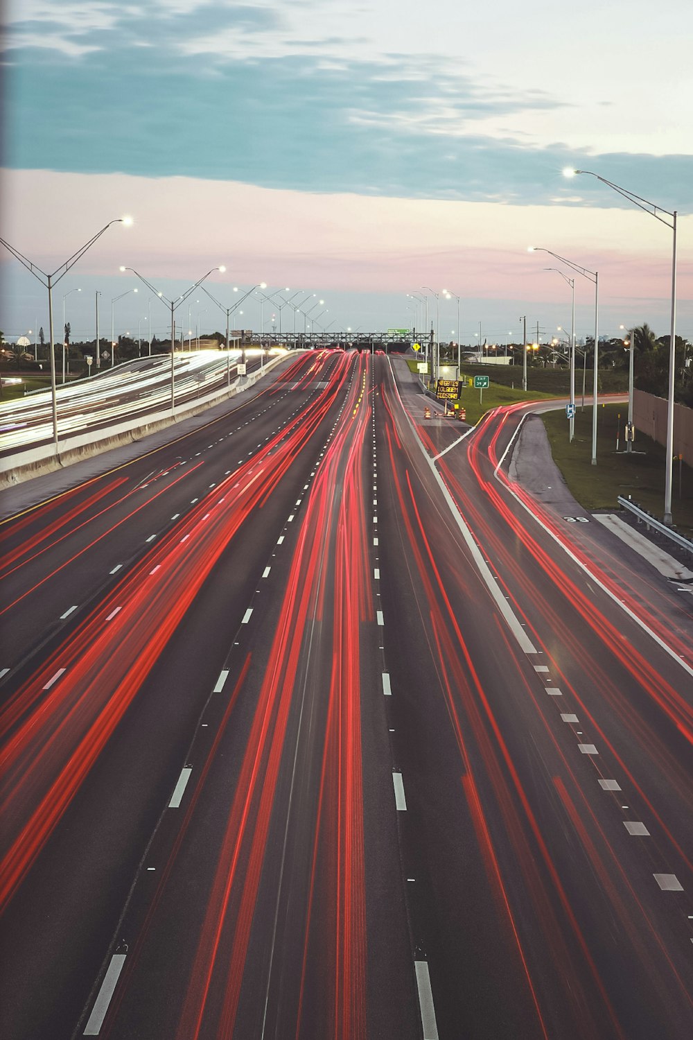 time lapse photography of cars on road during night time