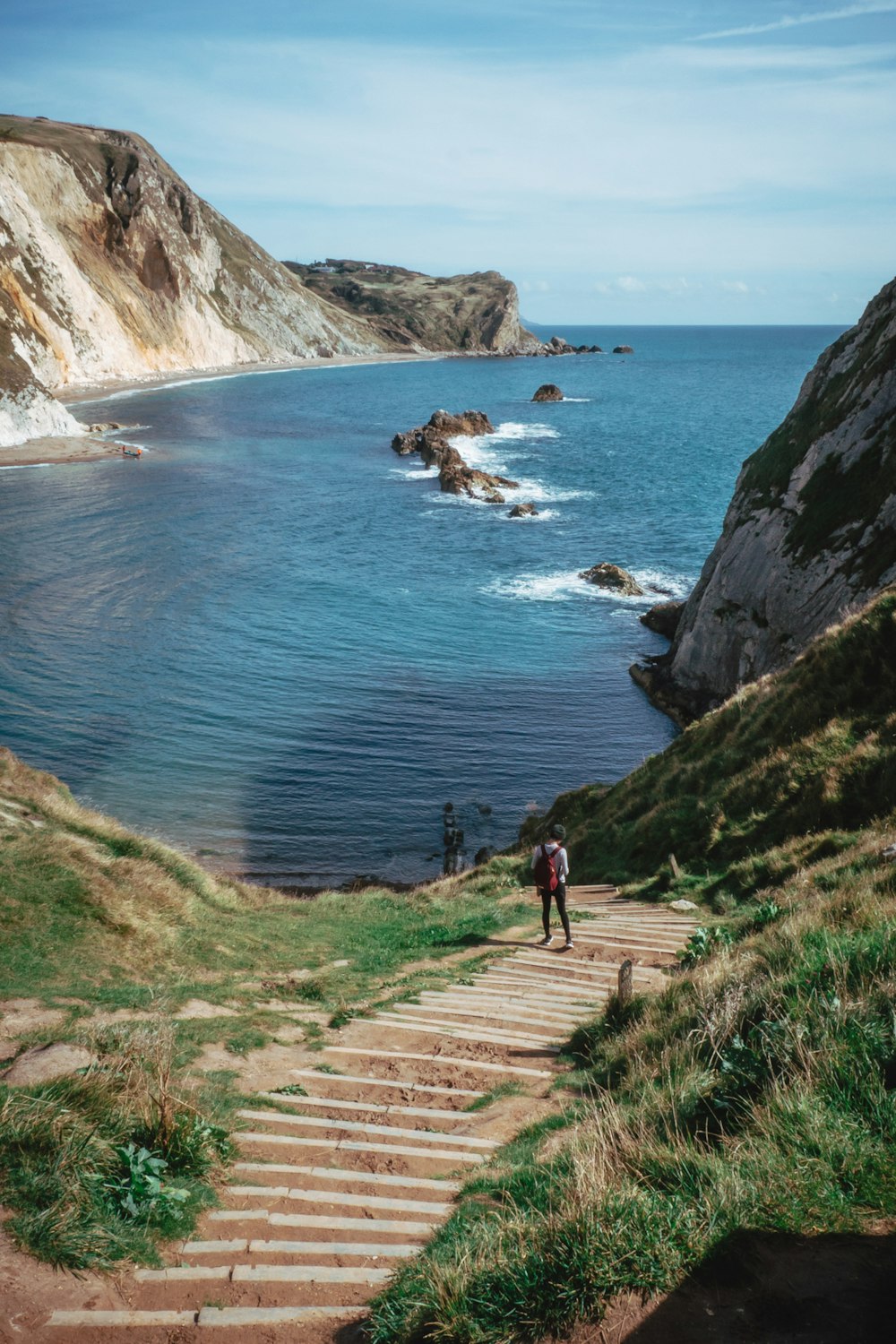 people walking on beach shore during daytime