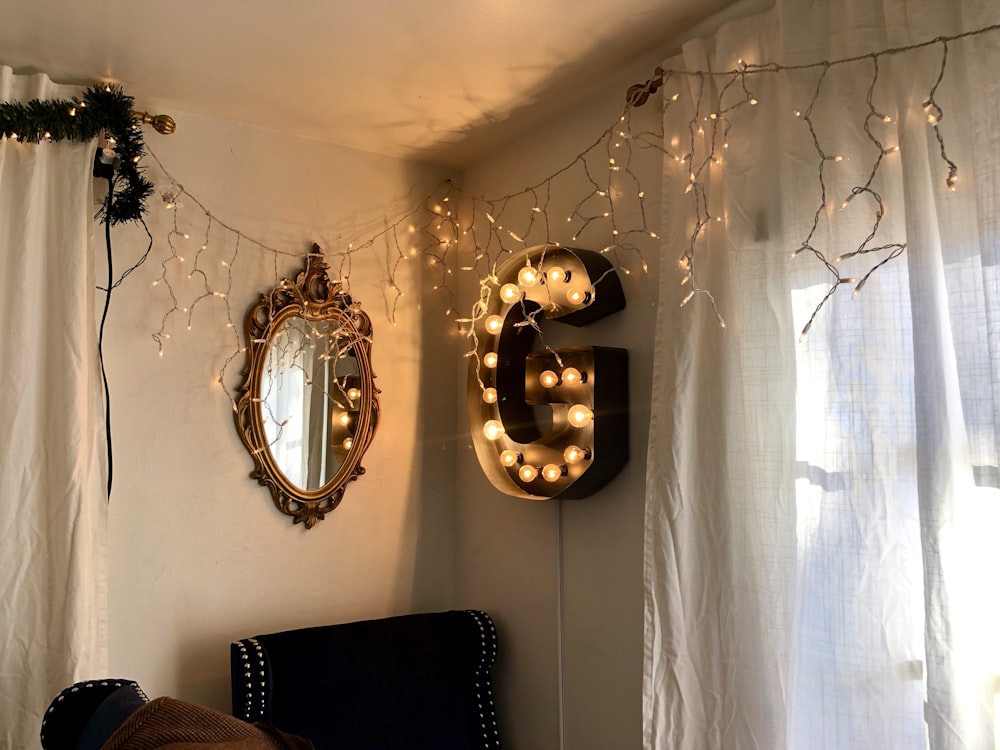 gold framed mirror on white wall