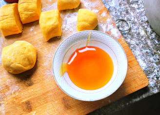 orange liquid on white ceramic bowl