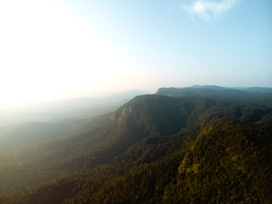 green and brown mountain under blue sky during daytime in Agumbe India