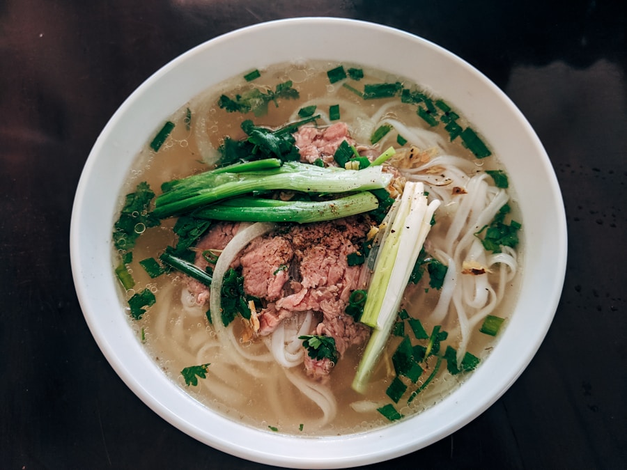 Bowl of traditional Vietnamese pho with fresh herbs