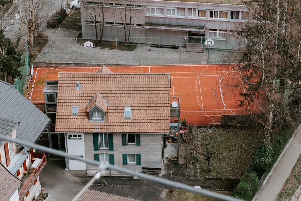 brown brick building near green trees during daytime