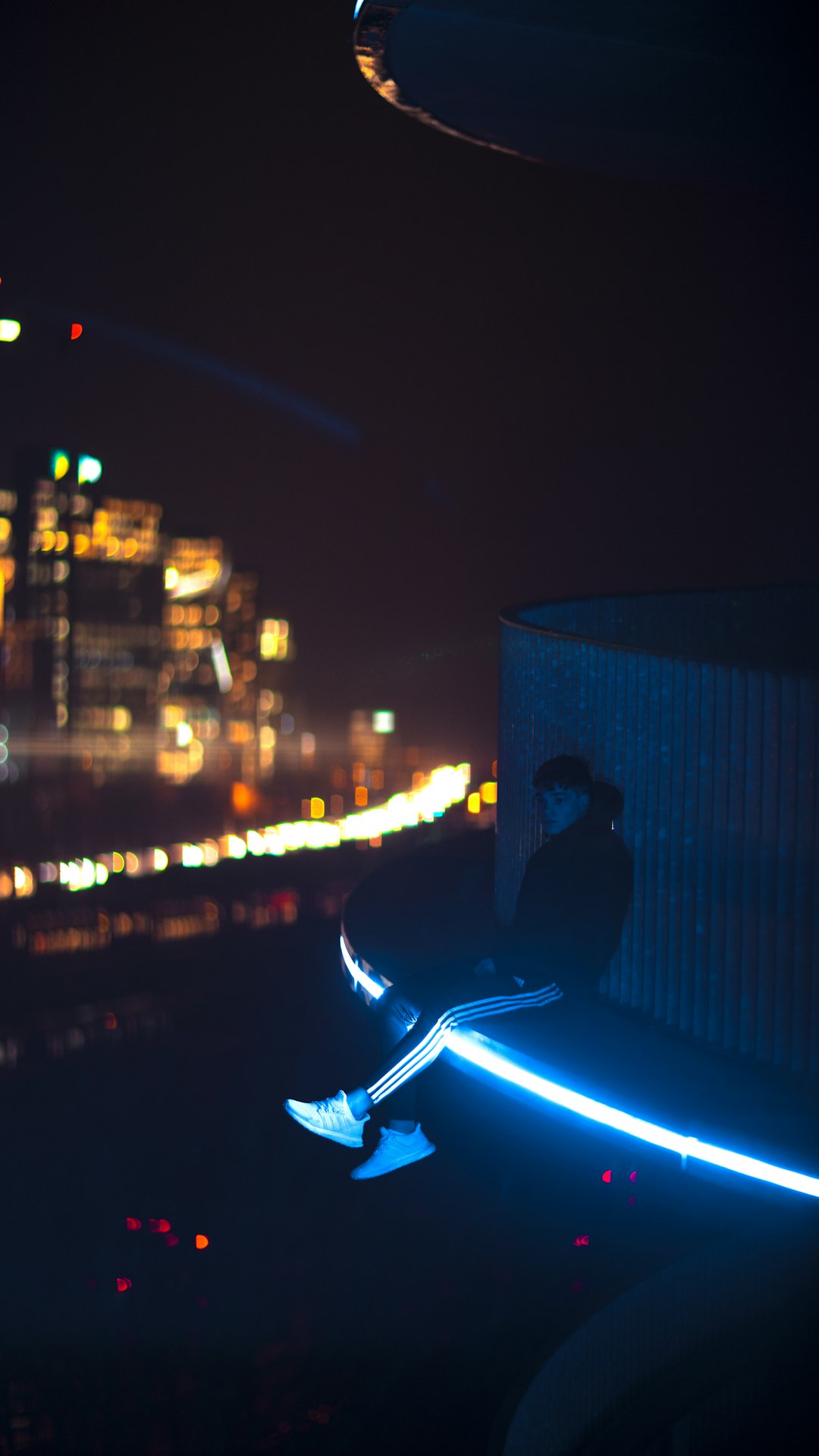 person in black jacket driving car during night time