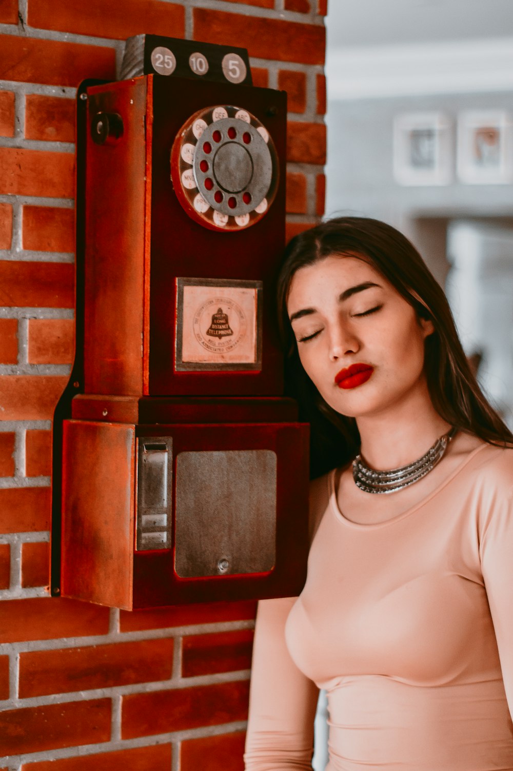 woman in white shirt wearing silver necklace