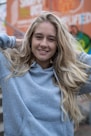 woman in gray crew neck shirt smiling