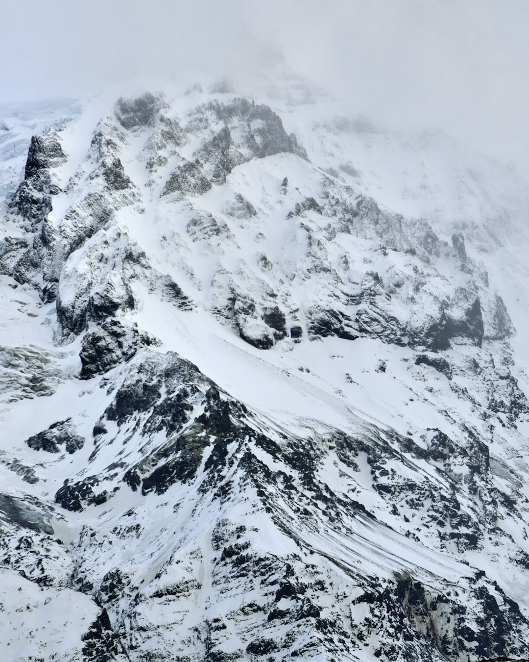 snow covered mountain during daytime