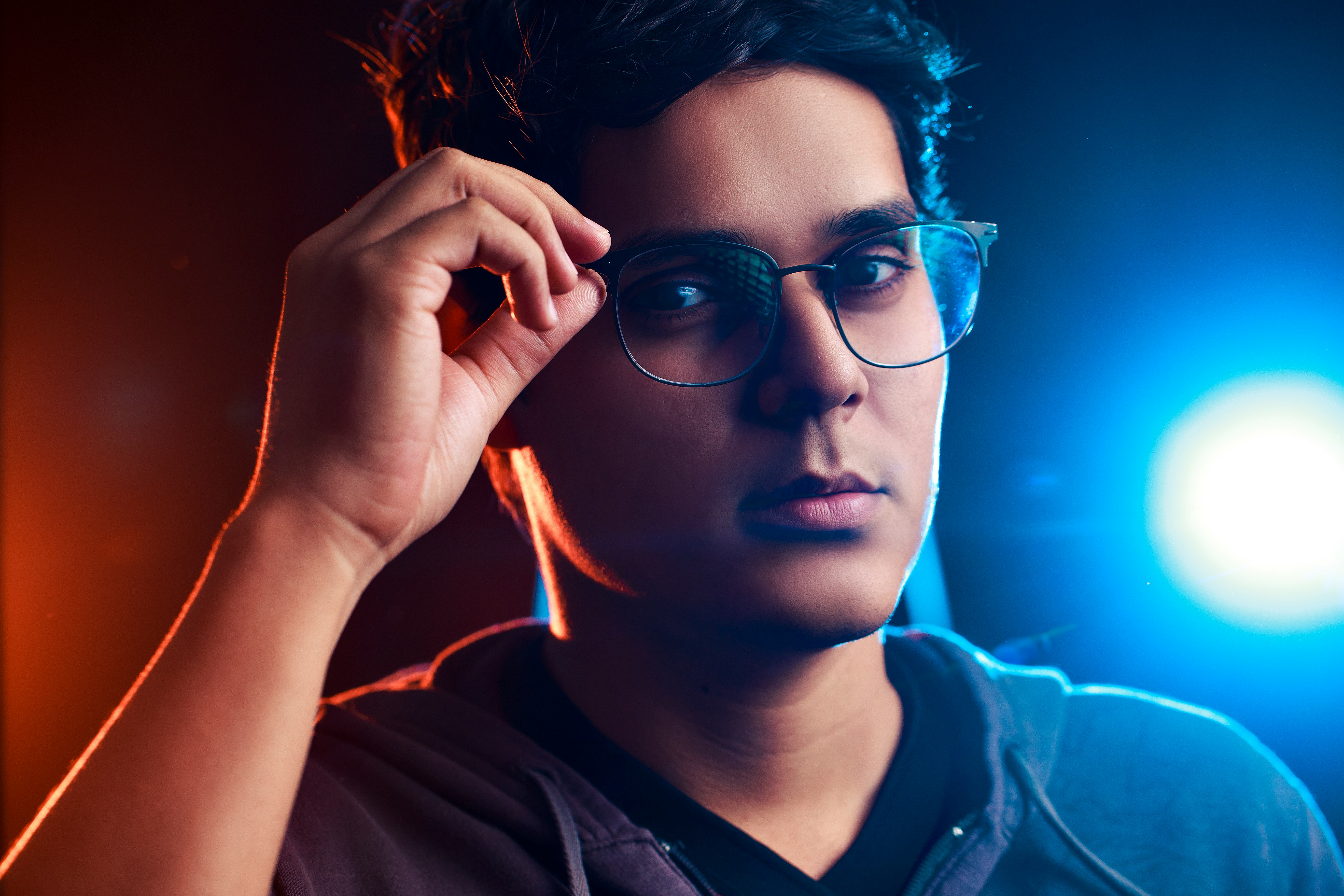 woman in black framed eyeglasses and black collared shirt