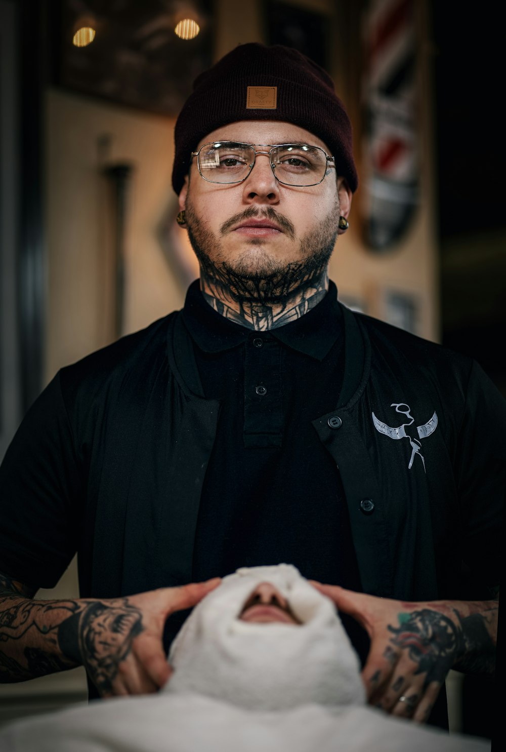 man in black button up shirt wearing black sunglasses