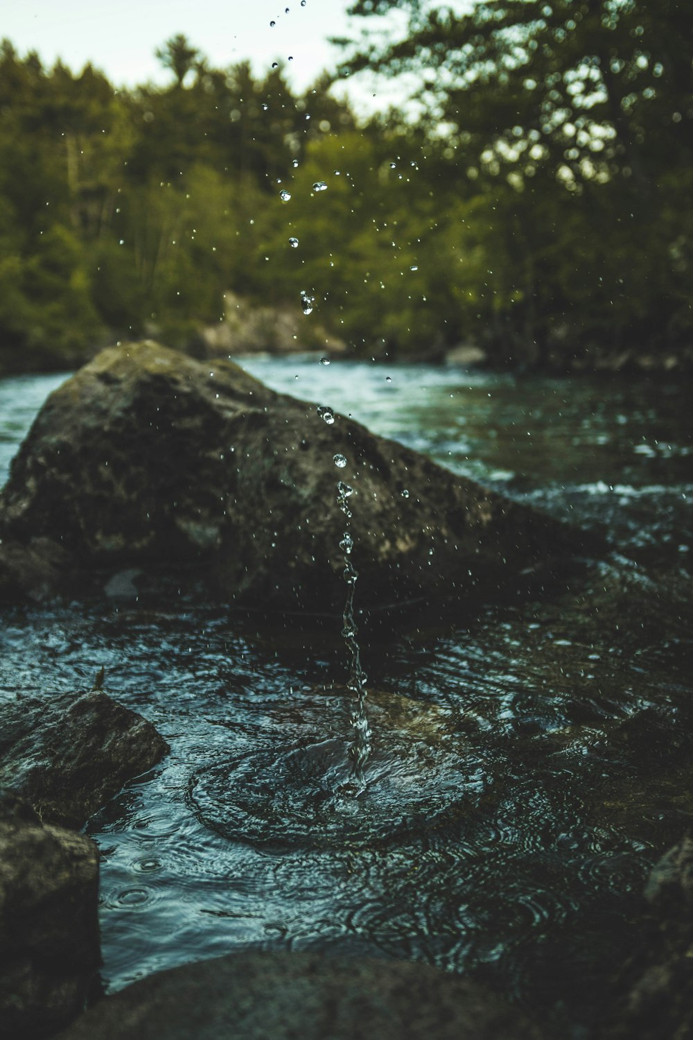 water falling from gray rock