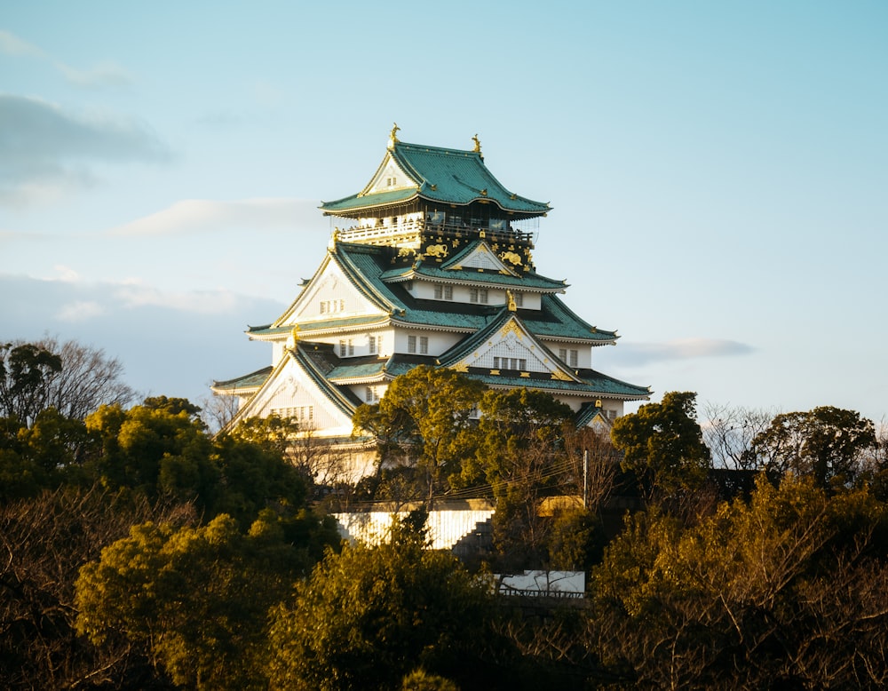 white and green temple under blue sky during daytime