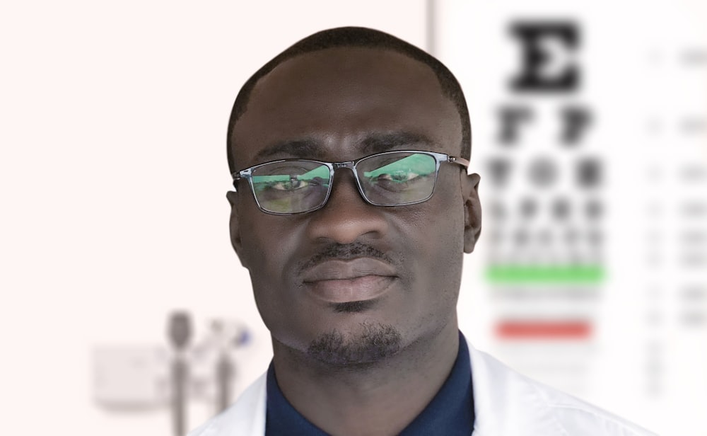 man in blue and white suit wearing black framed eyeglasses