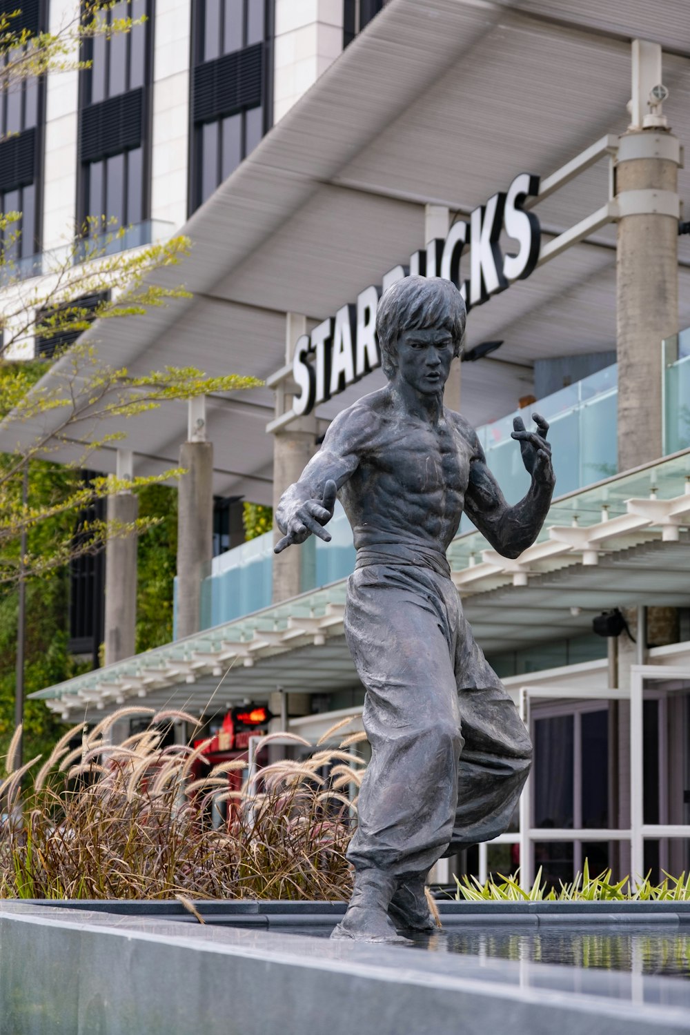 man in black and white hat statue