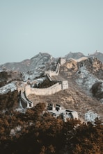 aerial view of gray concrete building on top of mountain during daytime