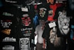 A variety of T-shirts are displayed with humorous and bold text designs, featuring phrases like 'I don't need Google,' and graphics such as lions and tigers. The T-shirts are predominantly dark with bright text and images.
