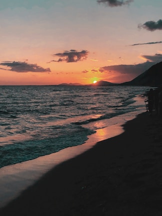 A candid laugh captured during a sunset beach walk.
